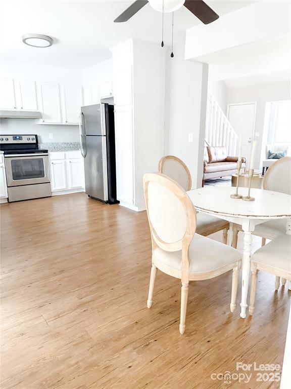 8224 Rittenhouse Circle Charlotte, NC 28270 - Photo 13 of 34 a dining room with furniture and wooden floor