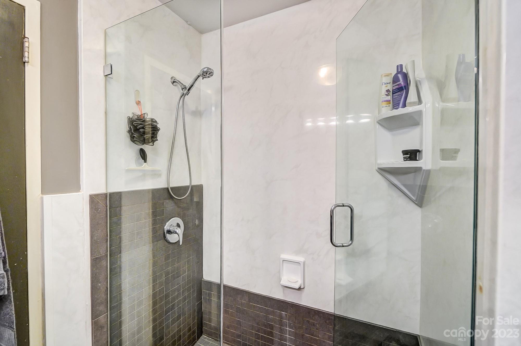 1300 Queens Road, Unit 208 Charlotte, NC 28207 - Photo 23 of 34 a bathroom with a shower