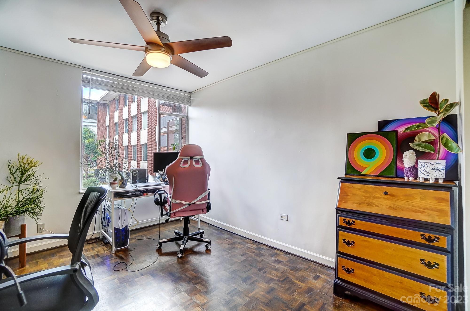 1300 Queens Road, Unit 208 Charlotte, NC 28207 - Photo 25 of 34 a view of a workspace with furniture and a window