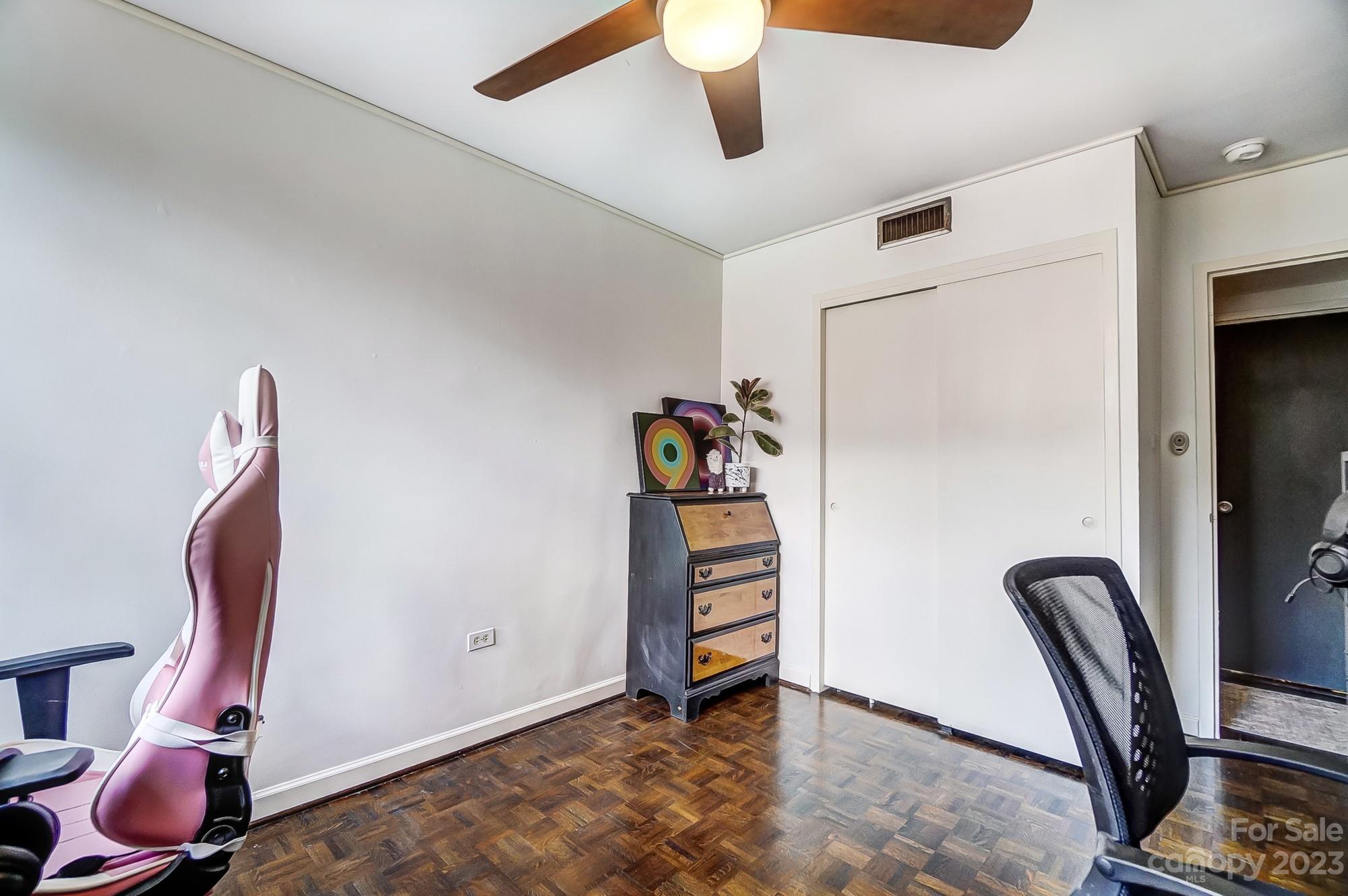 1300 Queens Road, Unit 208 Charlotte, NC 28207 - Photo 27 of 34 a view of a workspace with furniture and closet