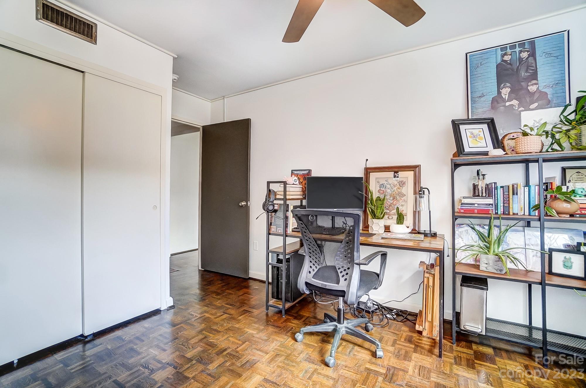 1300 Queens Road, Unit 208 Charlotte, NC 28207 - Photo 28 of 34 a view of a workspace with furniture and a window