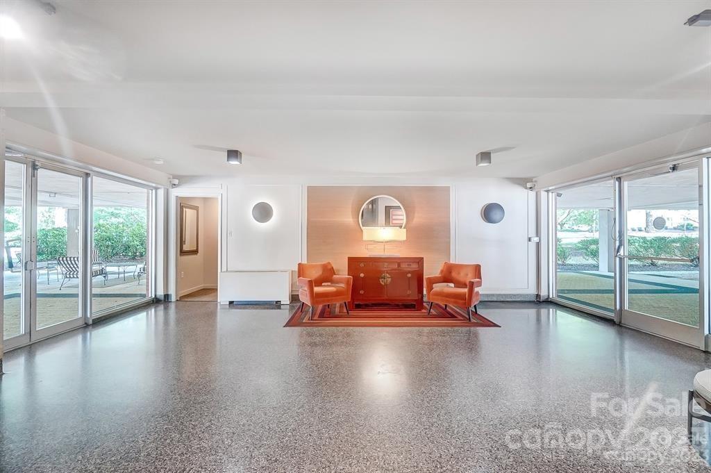 1300 Queens Road, Unit 208 Charlotte, NC 28207 - Photo 33 of 34 a view of livingroom with furniture wooden floor and windows