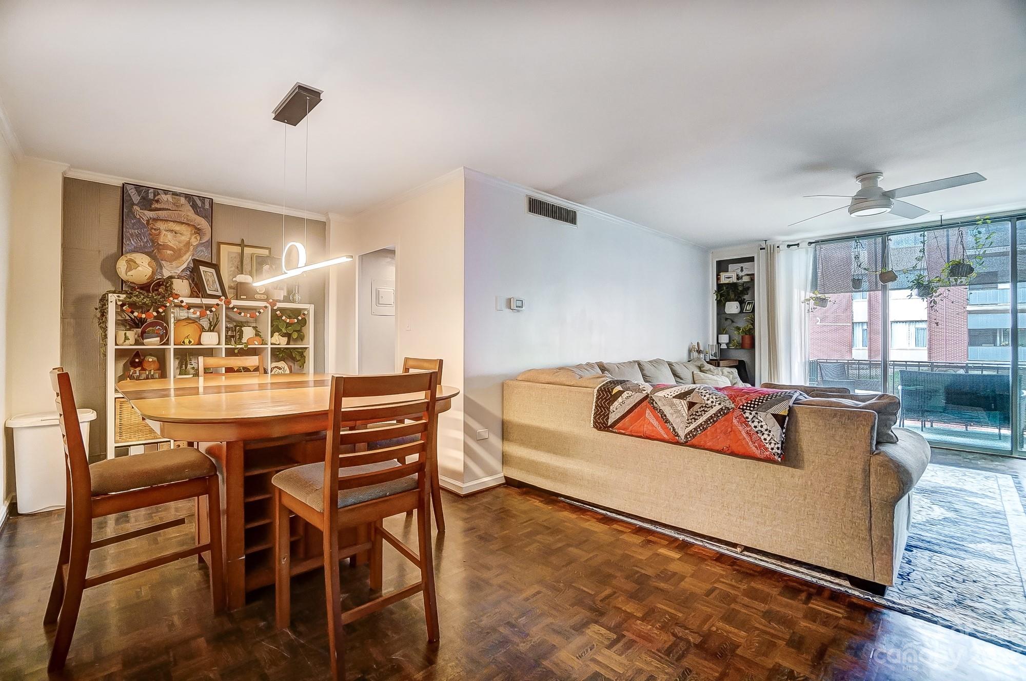 1300 Queens Road, Unit 208 Charlotte, NC 28207 - Photo 8 of 34 a bedroom with furniture and a large window