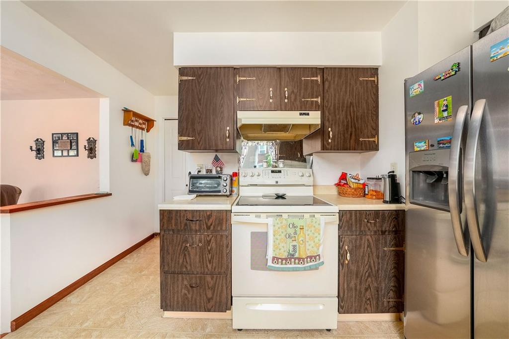 5403 Hardt Road Gibsonia, PA 15044 - Photo 11 of 41 a kitchen with stainless steel appliances a stove a refrigerator and a refrigerator