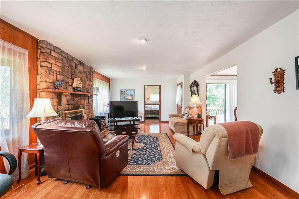 5403 Hardt Road Gibsonia, PA 15044 - Photo 13 of 41 a living room with furniture fireplace and flat screen tv