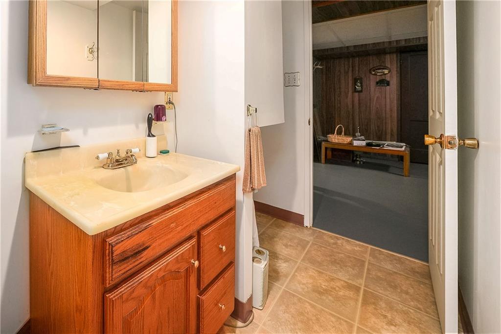 5403 Hardt Road Gibsonia, PA 15044 - Photo 32 of 41 a bathroom with a sink and a mirror
