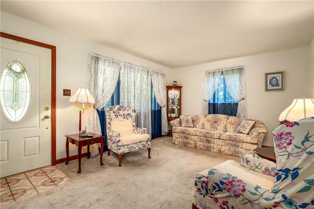 5403 Hardt Road Gibsonia, PA 15044 - Photo 7 of 41 a living room with furniture a bed and a chandelier