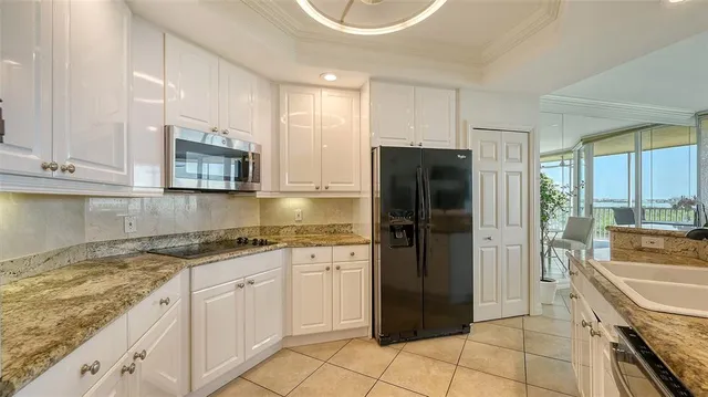 an aerial view of a house with a yard and outdoor seating