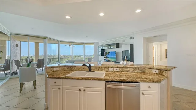 a front view of a house with yard and flowers