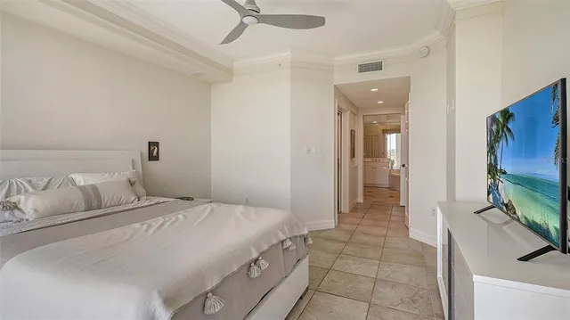 a living room with furniture and a floor to ceiling windows