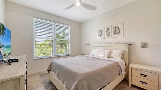 a view of a living room with furniture and garden view