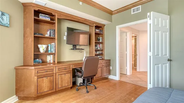 a view of a ocean with a table chairs and a swimming pool