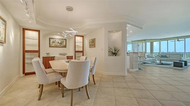 a view of a balcony with chair and floor to ceiling window
