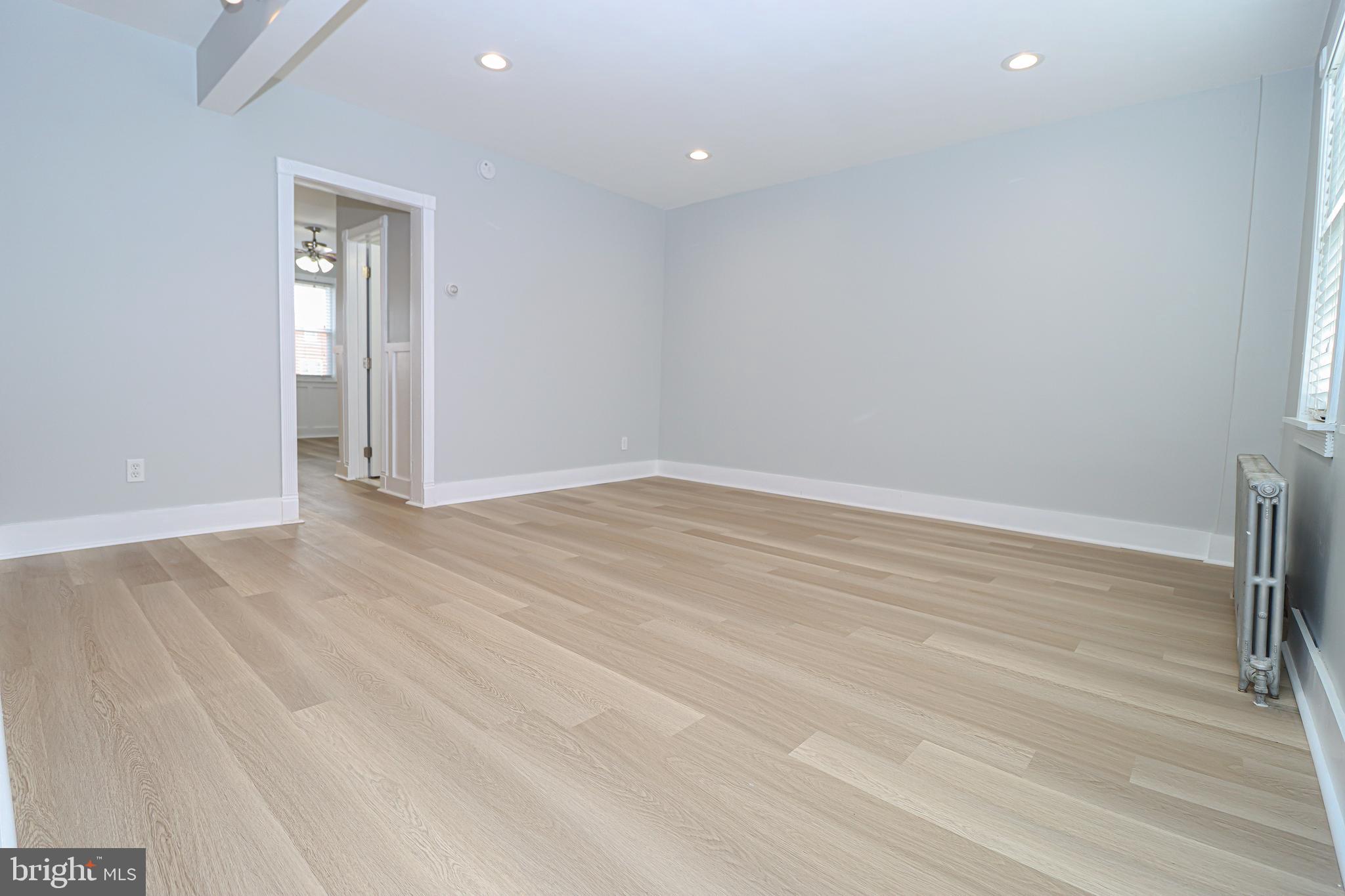 2933 Cornwall Road Baltimore, MD 21222 - Photo 7 of 35 Living room opens to kitchen and dining area