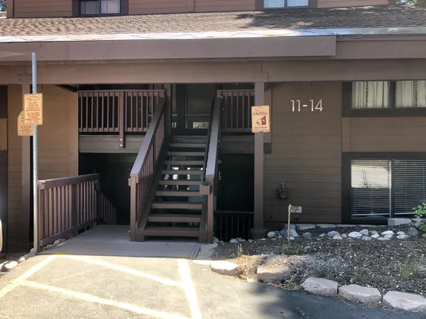 a view of a house with backyard porch and wooden floor