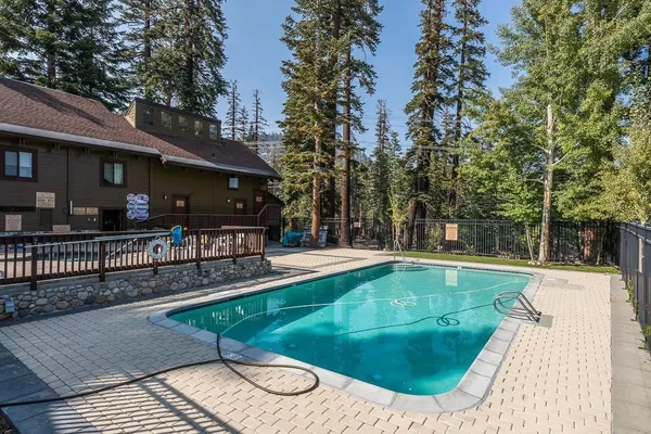 a view of a swimming pool with a patio