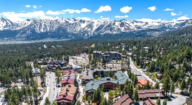 a aerial view of a house with a yard