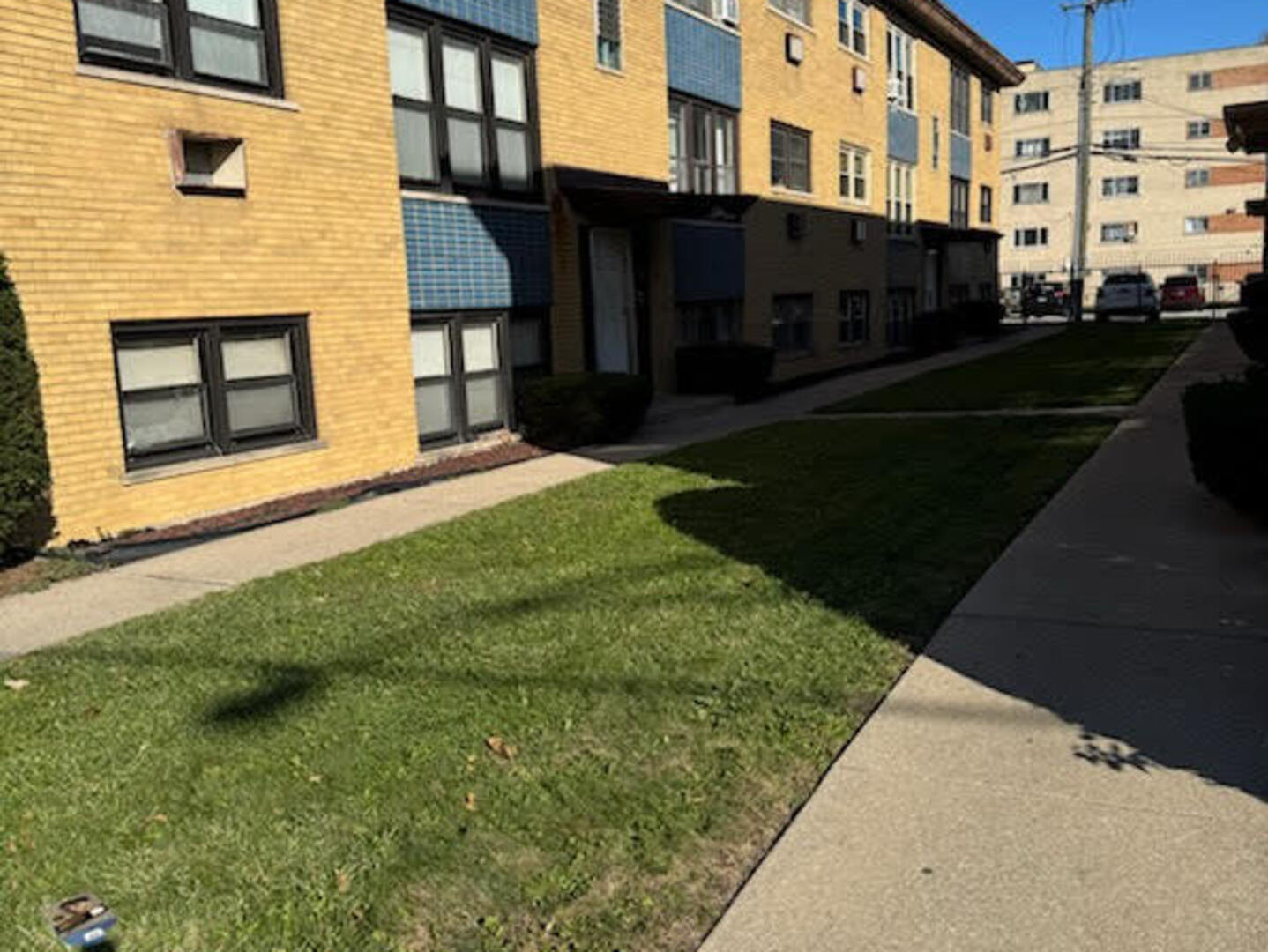 9209 South Cottage Grove Avenue, Unit A6 Chicago, IL 60619 - Photo 2 of 12 a view of a street with brick walls