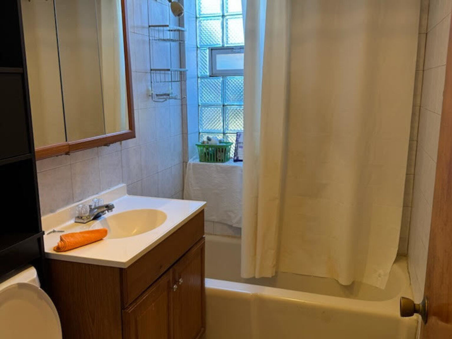 9209 South Cottage Grove Avenue, Unit A6 Chicago, IL 60619 - Photo 10 of 12 a bathroom with a sink and a bathtub