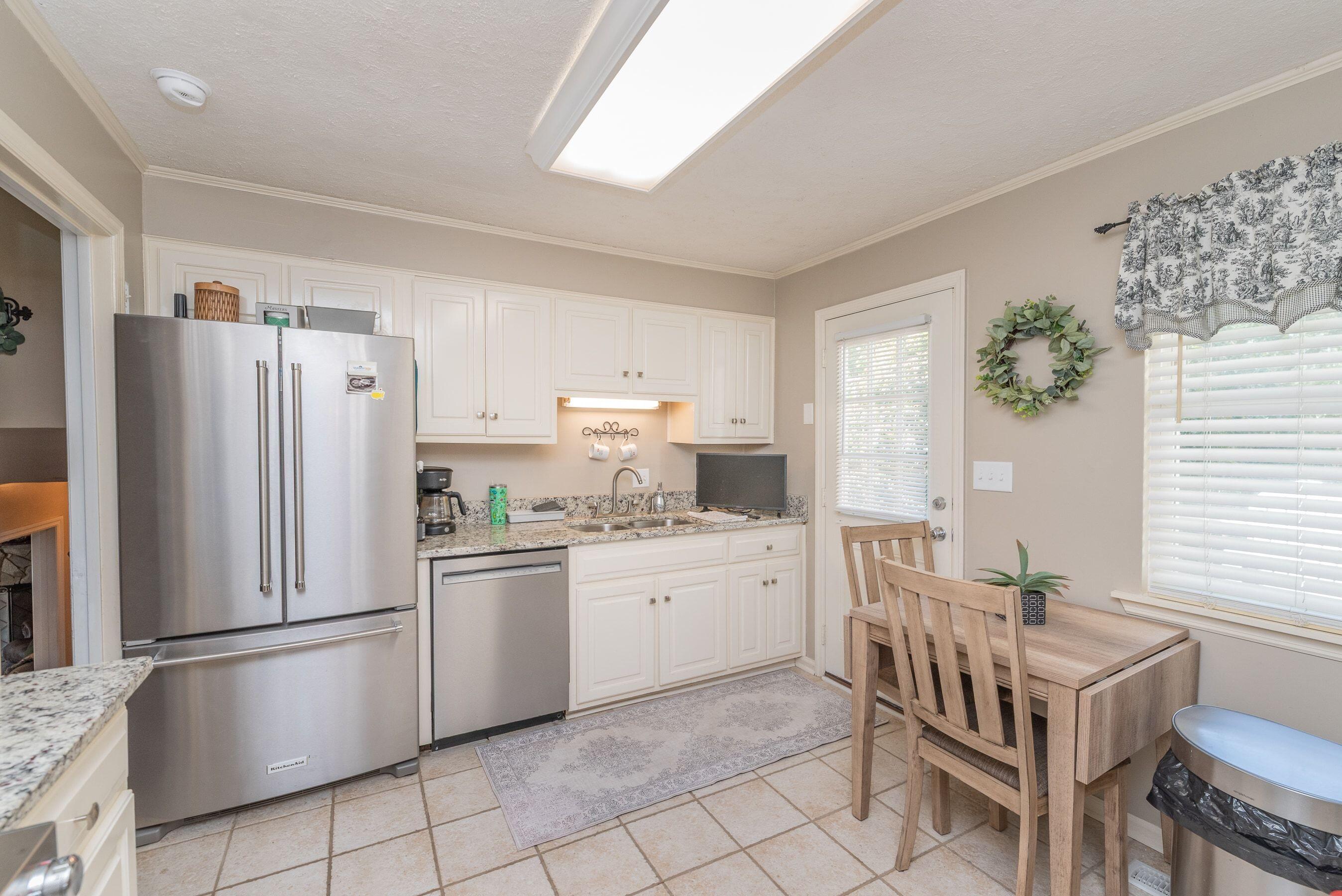 1117 Ridgemont Drive Aiken, SC 29803 - Photo 11 of 49 a kitchen with stainless steel appliances a refrigerator and a stove top oven