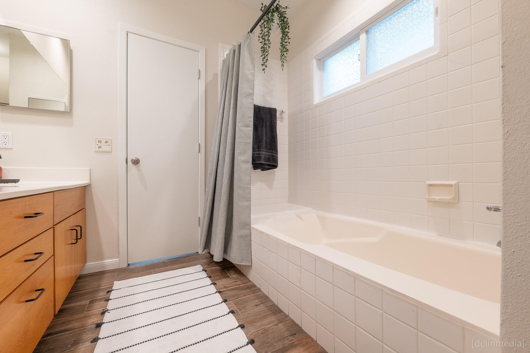 2002 Norfolk Street, Unit A Houston, TX 77098 - Photo 28 of 35 a bathroom with a bathtub and a sink