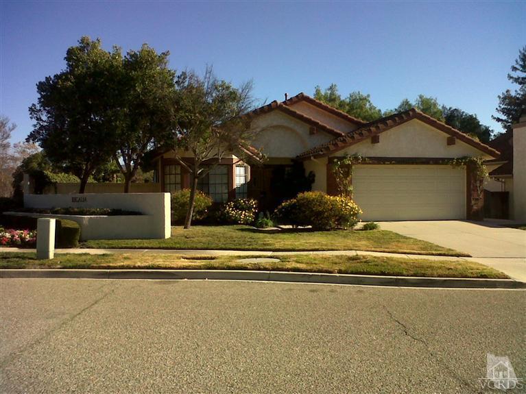 596 Fresh Meadows Road Simi Valley, CA 93065 - Photo 1 of 16 a front view of a house with a garden