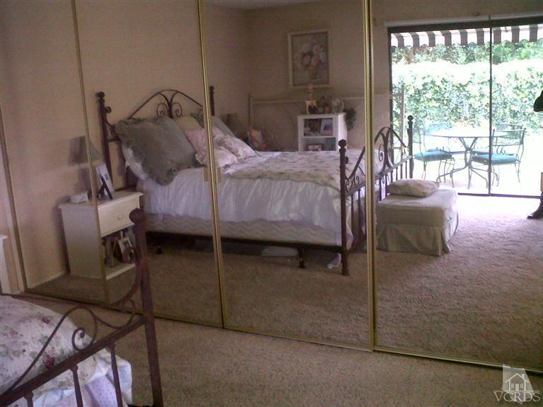 596 Fresh Meadows Road Simi Valley, CA 93065 - Photo 11 of 16 a bedroom with a bed and a view of chair