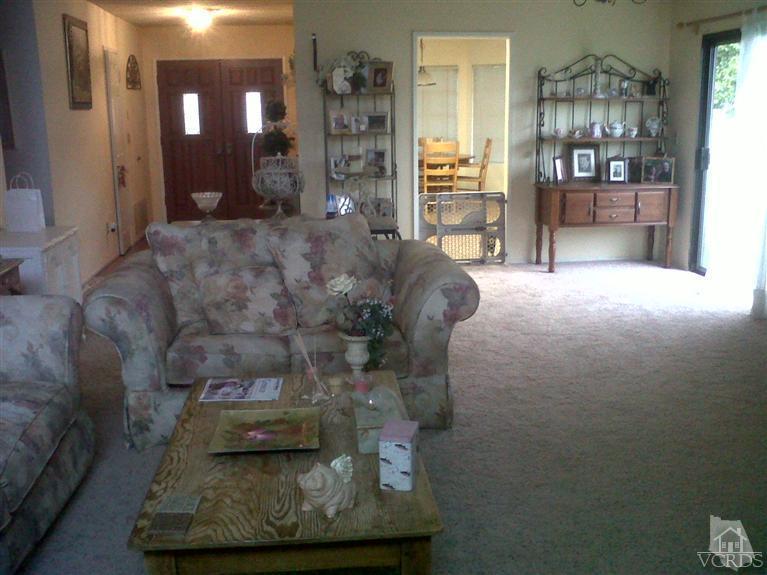 596 Fresh Meadows Road Simi Valley, CA 93065 - Photo 3 of 16 a living room with furniture and a fireplace