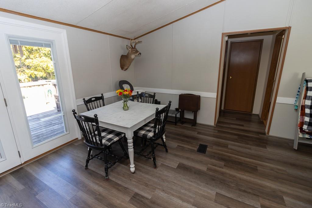 8280 Stafford Mill Road Oak Ridge, NC 27310 - Photo 40 of 40 aS YOUI CAN SEE THIS IS A VERY OPEN FLOOR PLAN. THIS IS THE DINING AREA.