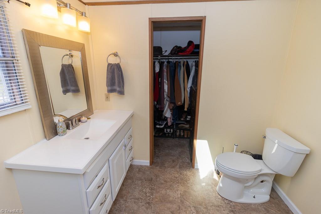 8280 Stafford Mill Road Oak Ridge, NC 27310 - Photo 22 of 40 PRIMARY BATH - WALKIN CLOSET.