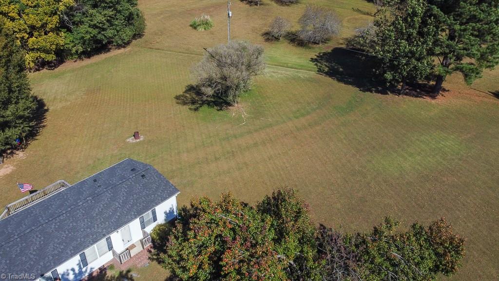 8280 Stafford Mill Road Oak Ridge, NC 27310 - Photo 32 of 40 IN THE UPER PART OF THE PICTURE, YOU SEE THE SMALL DITCH... THE IS THE PROPERTY LINE AREA