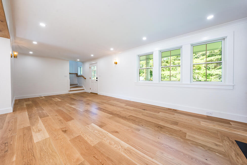 289 Santuit-Newtown Road Marstons Mills, MA 02648 - Photo 15 of 36 an empty room with wooden floor and windows