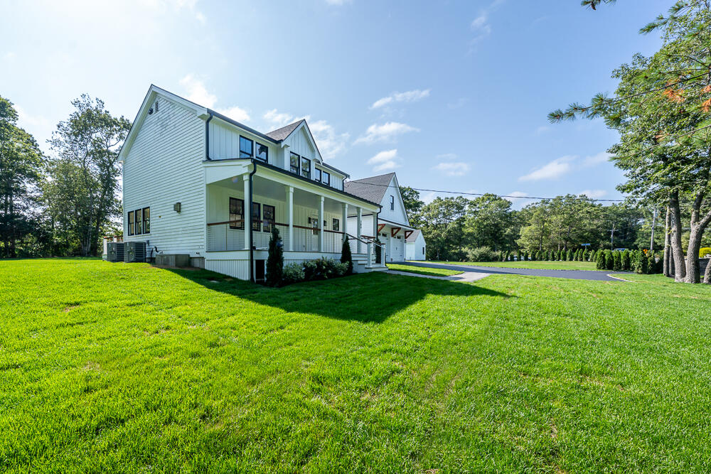 289 Santuit-Newtown Road Marstons Mills, MA 02648 - Photo 4 of 36 a view of a house with backyard and garden