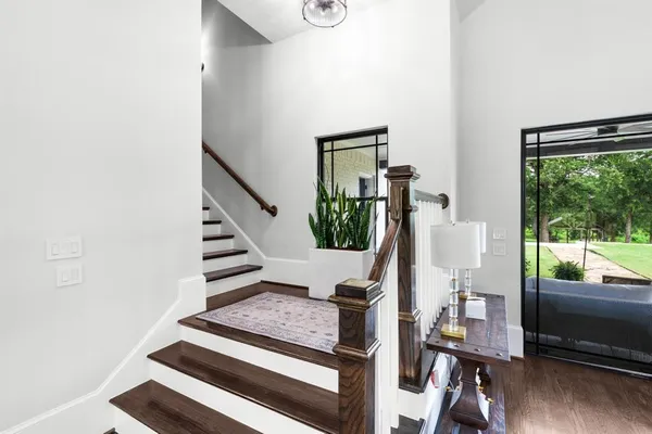 a kitchen with a stove a refrigerator and wooden cabinets