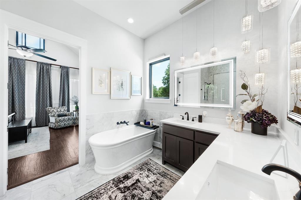 365 Private Road 5529 Point, TX 75472 - Photo 30 of 40 a spacious bathroom with a double vanity sink a mirror a bathtub and a shower