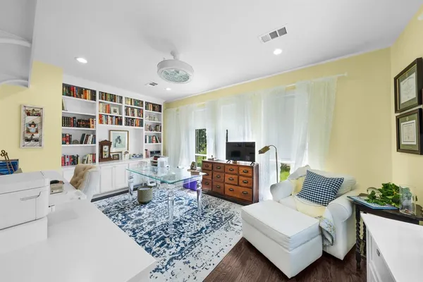 a bedroom with a bed and a table