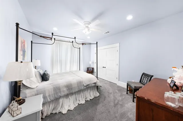 a bedroom with a bed and a table