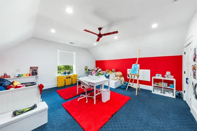 a living room with furniture a rug and a pool table