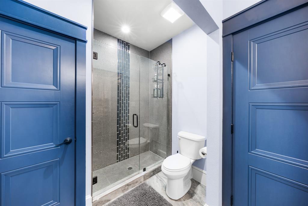 365 Private Road 5529 Point, TX 75472 - Photo 40 of 40 a bathroom with a granite countertop toilet a sink and shower