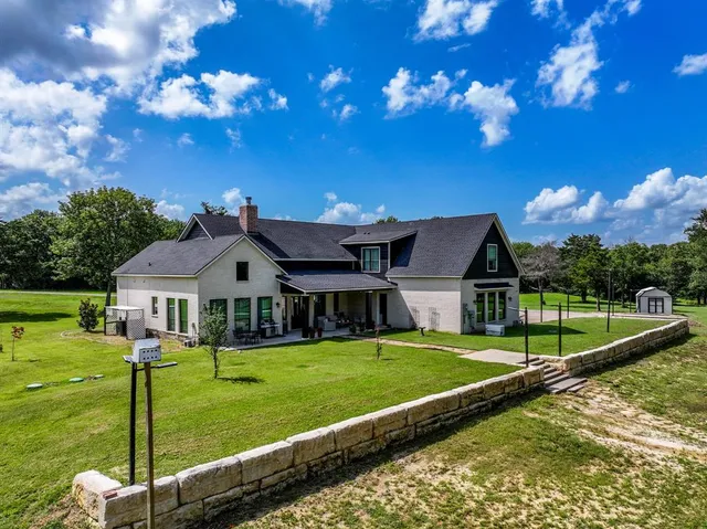 a view of a house with a big yard