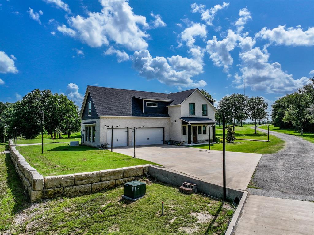 365 Private Road 5529 Point, TX 75472 - Photo 9 of 40 a house view with a garden space and wooden fence
