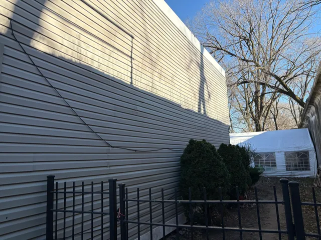 a view of a house with a street