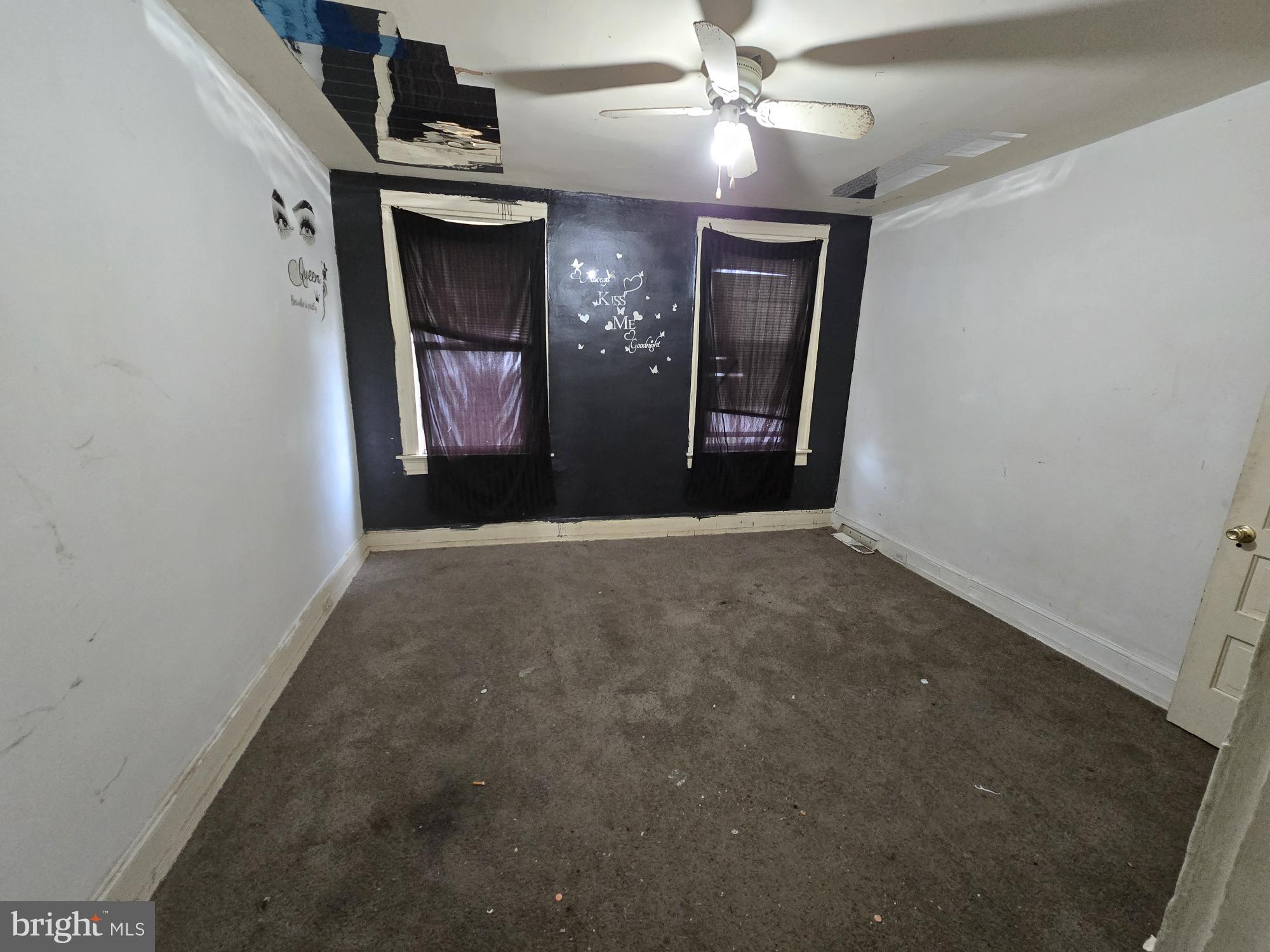 653 Bartlett Avenue Baltimore, MD 21218 - Photo 13 of 14 a view of a hallway with a chandelier