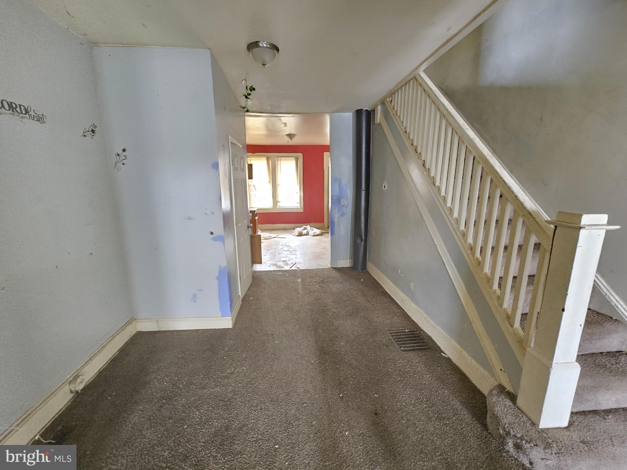 653 Bartlett Avenue Baltimore, MD 21218 - Photo 4 of 14 a view of hallway with stairs
