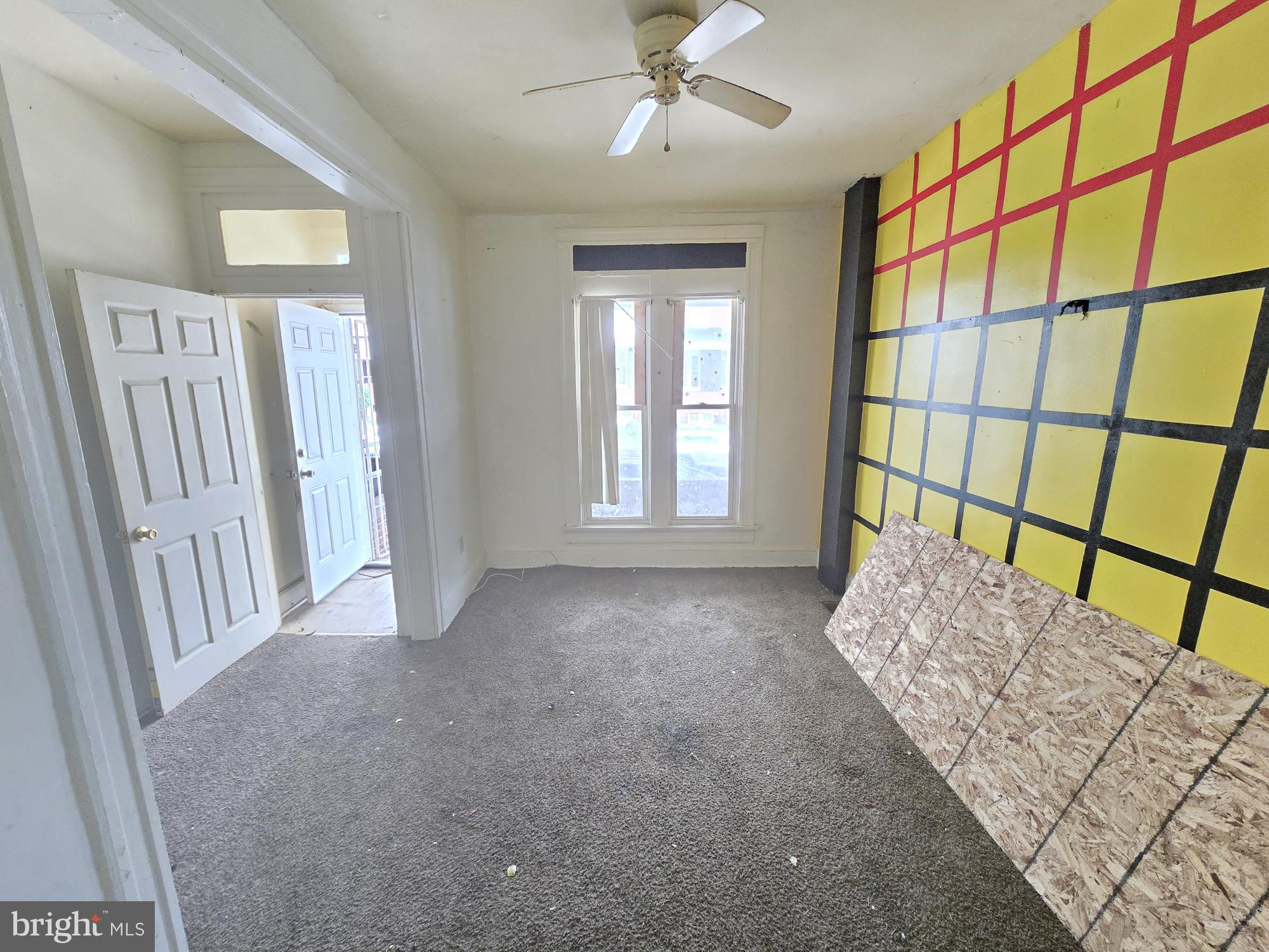 653 Bartlett Avenue Baltimore, MD 21218 - Photo 5 of 14 a view of an empty room and window