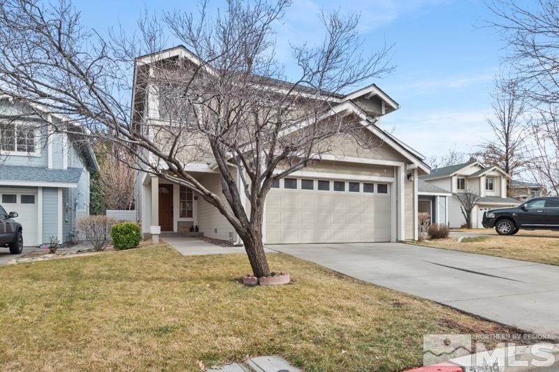 7595 Whimbleton Way Reno, NV 89511 - Photo 36 of 36 a front view of a house with a yard and garage