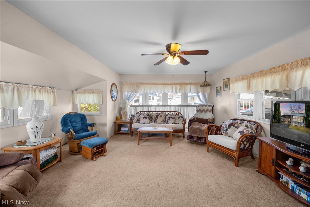 1623 Northeast Catawba Road, Unit 160 Port Clinton, OH 43452 - Photo 7 of 28 Living room with light carpet