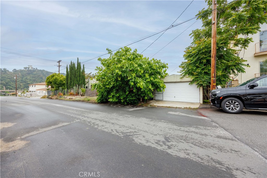 6903 Greeley Street Tujunga, CA 91042 - Photo 1 of 1 a street view with a car parked in front of it