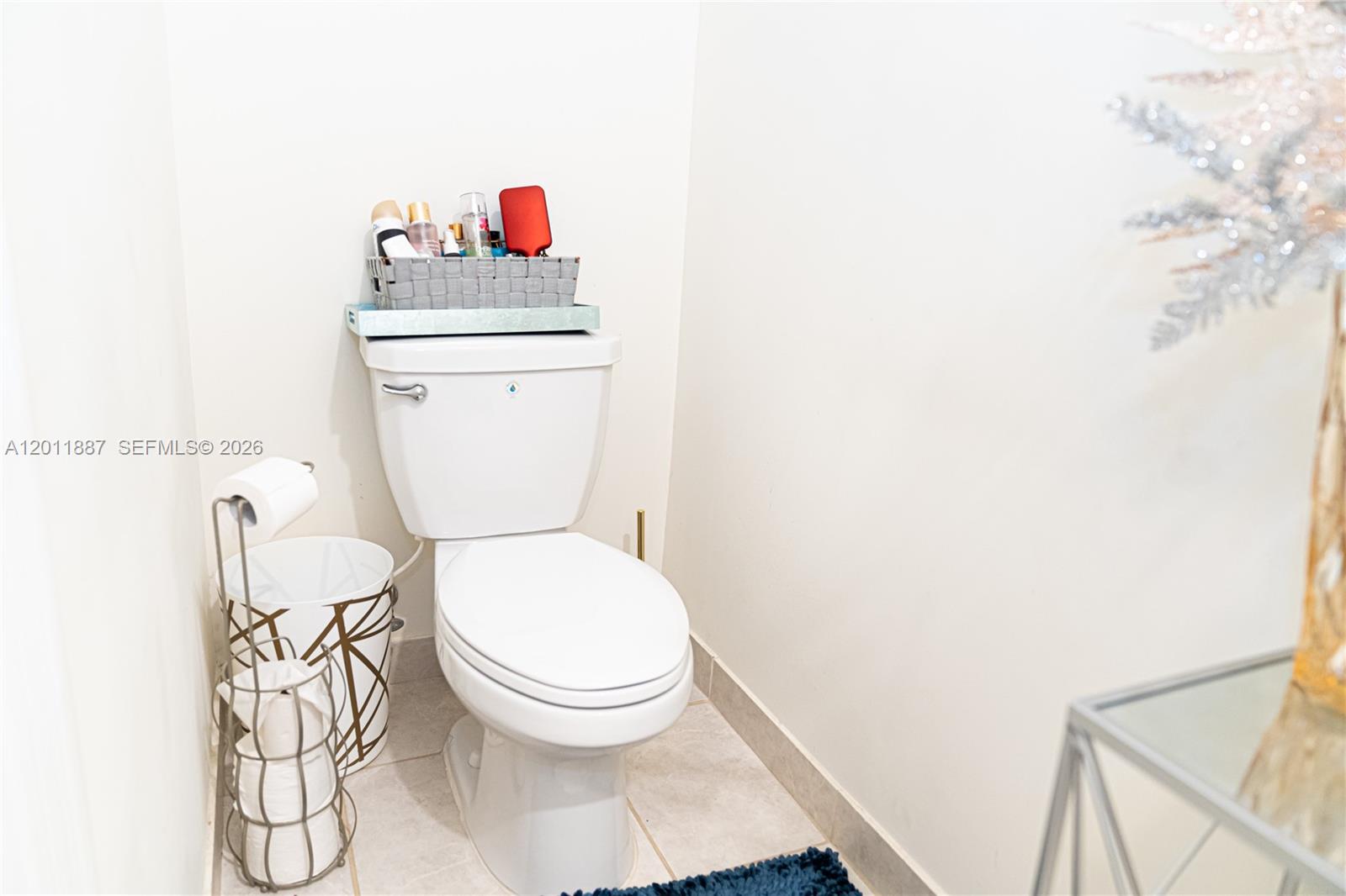 10599 West 33rd Court Hialeah, FL 33018 - Photo 16 of 39 a bathroom with a toilet and a sink