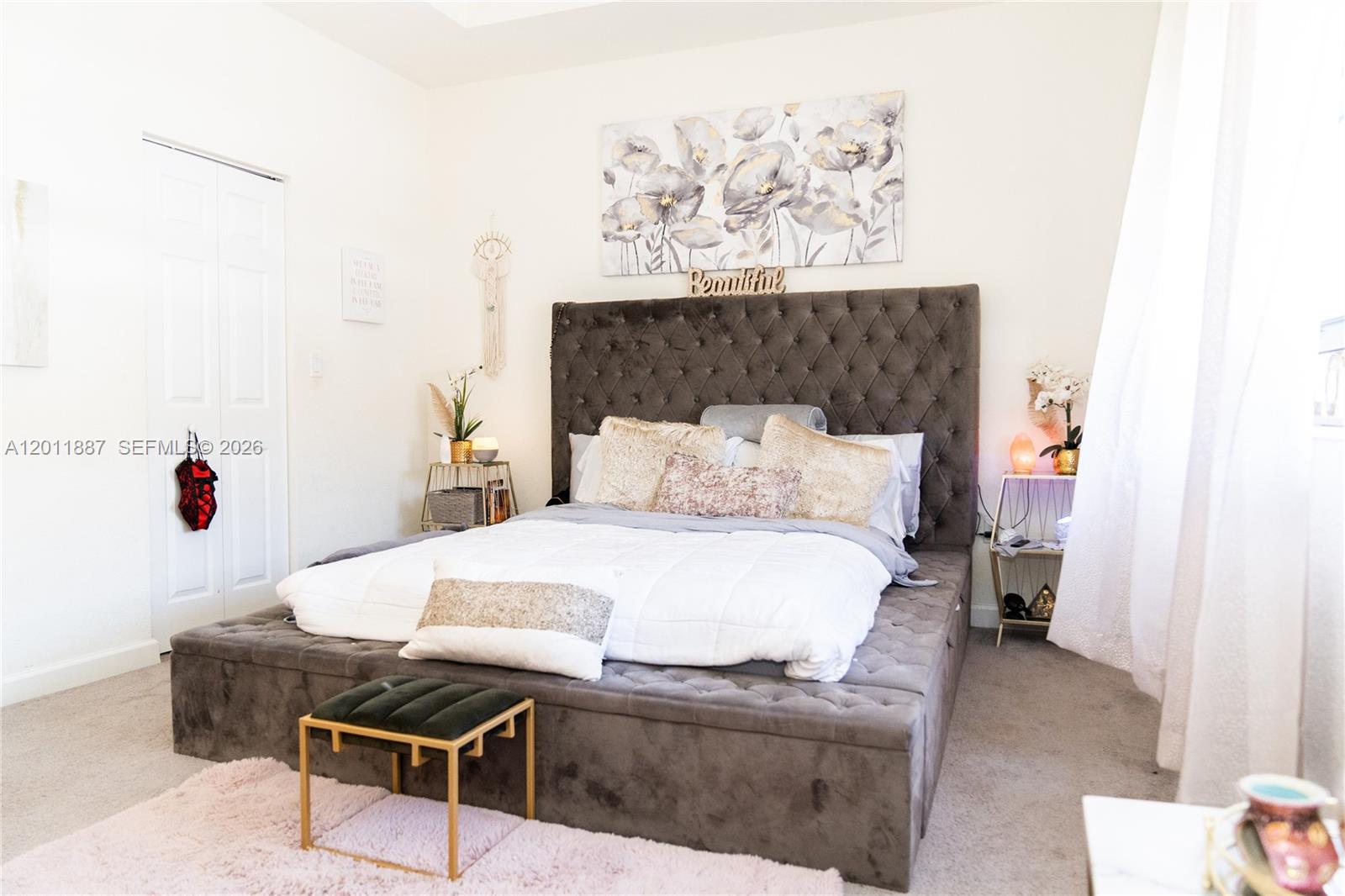 10599 West 33rd Court Hialeah, FL 33018 - Photo 17 of 39 a bedroom with a bed and a table in it